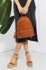 SHOMICO Certainly Chic Faux Leather Woven Backpack sold by Charming Charlie