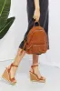 SHOMICO Certainly Chic Faux Leather Woven Backpack sold by Charming Charlie