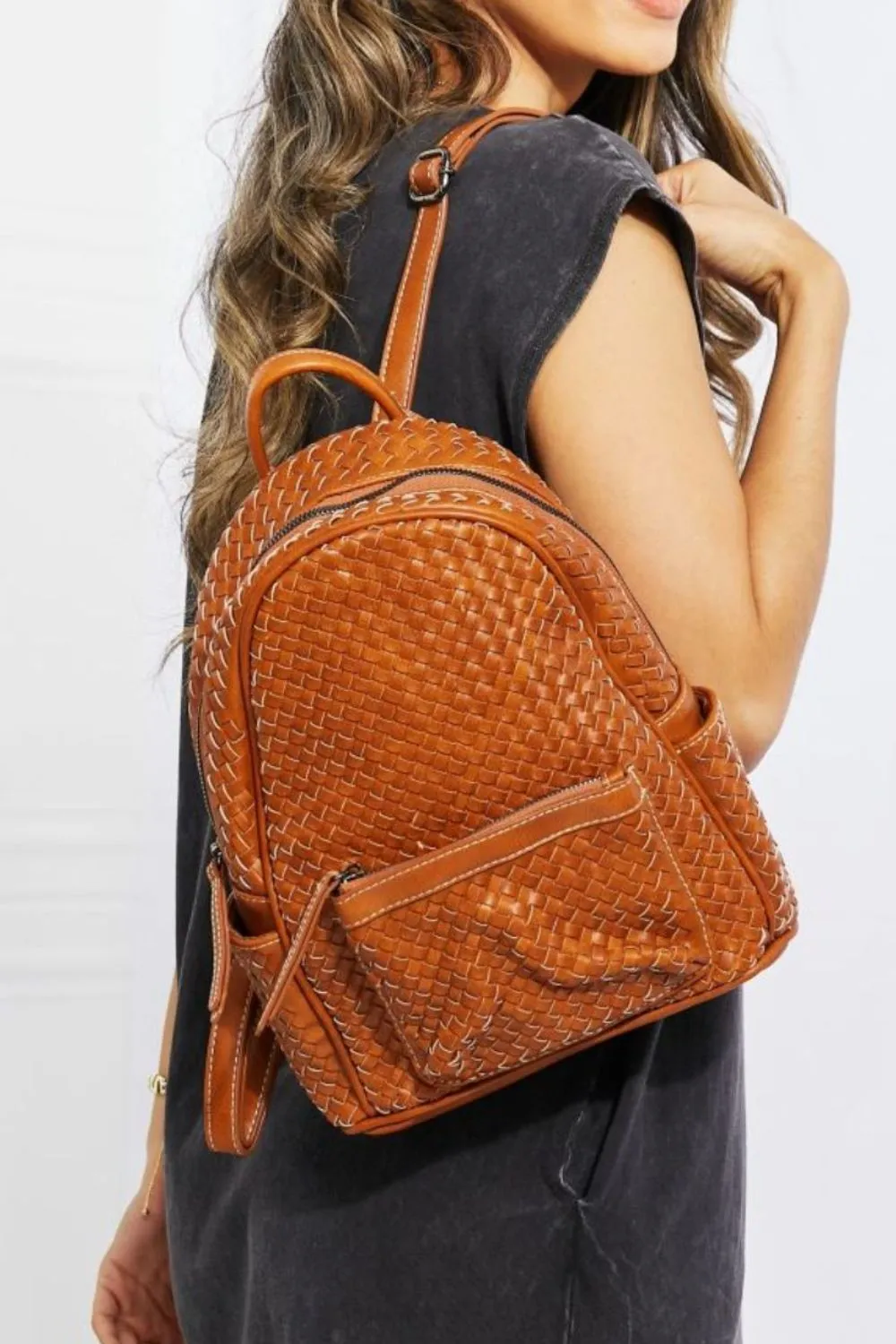 SHOMICO Certainly Chic Faux Leather Woven Backpack sold by Charming Charlie
