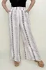 Geo Stripe Smocked Waist Wide Leg Pants sold by Charming Charlie