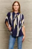 Tie Neck Printed Slit Sleeve Blouse sold by Charming Charlie
