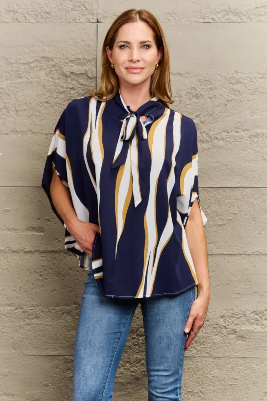 Tie Neck Printed Slit Sleeve Blouse sold by Charming Charlie
