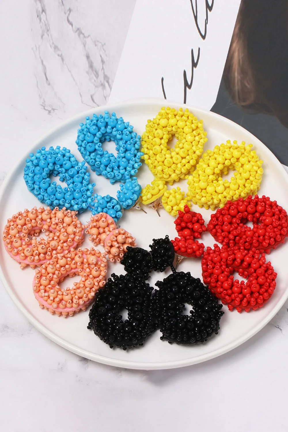 Beaded Dangle Earrings sold by Charming Charlie