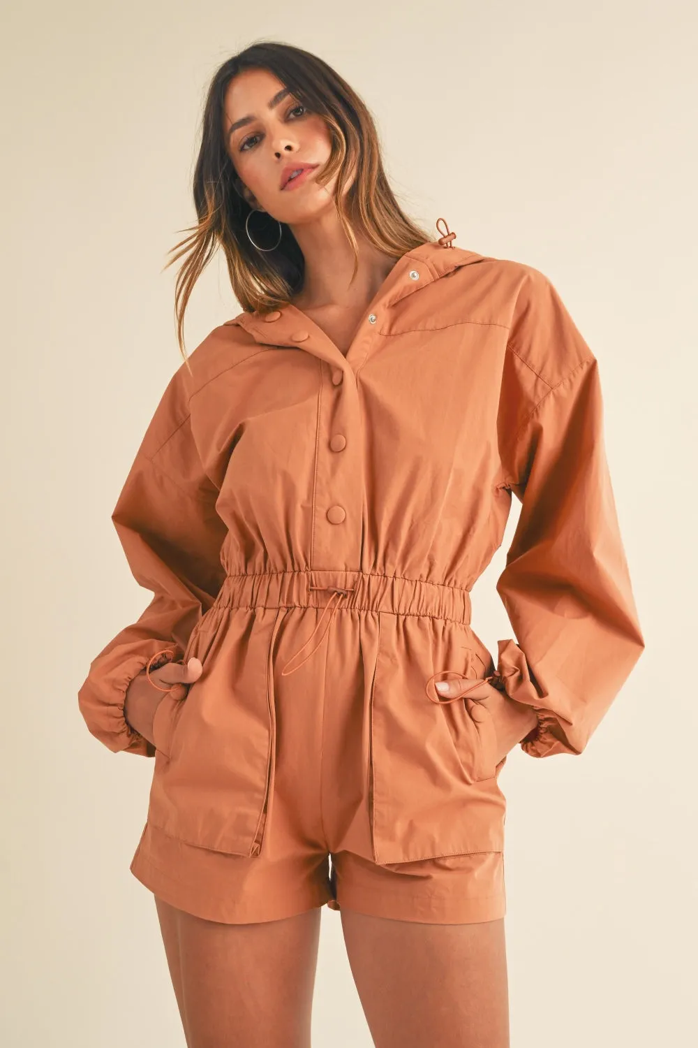 Mable Snap Down Long Sleeve Hooded Romper sold by Charming Charlie