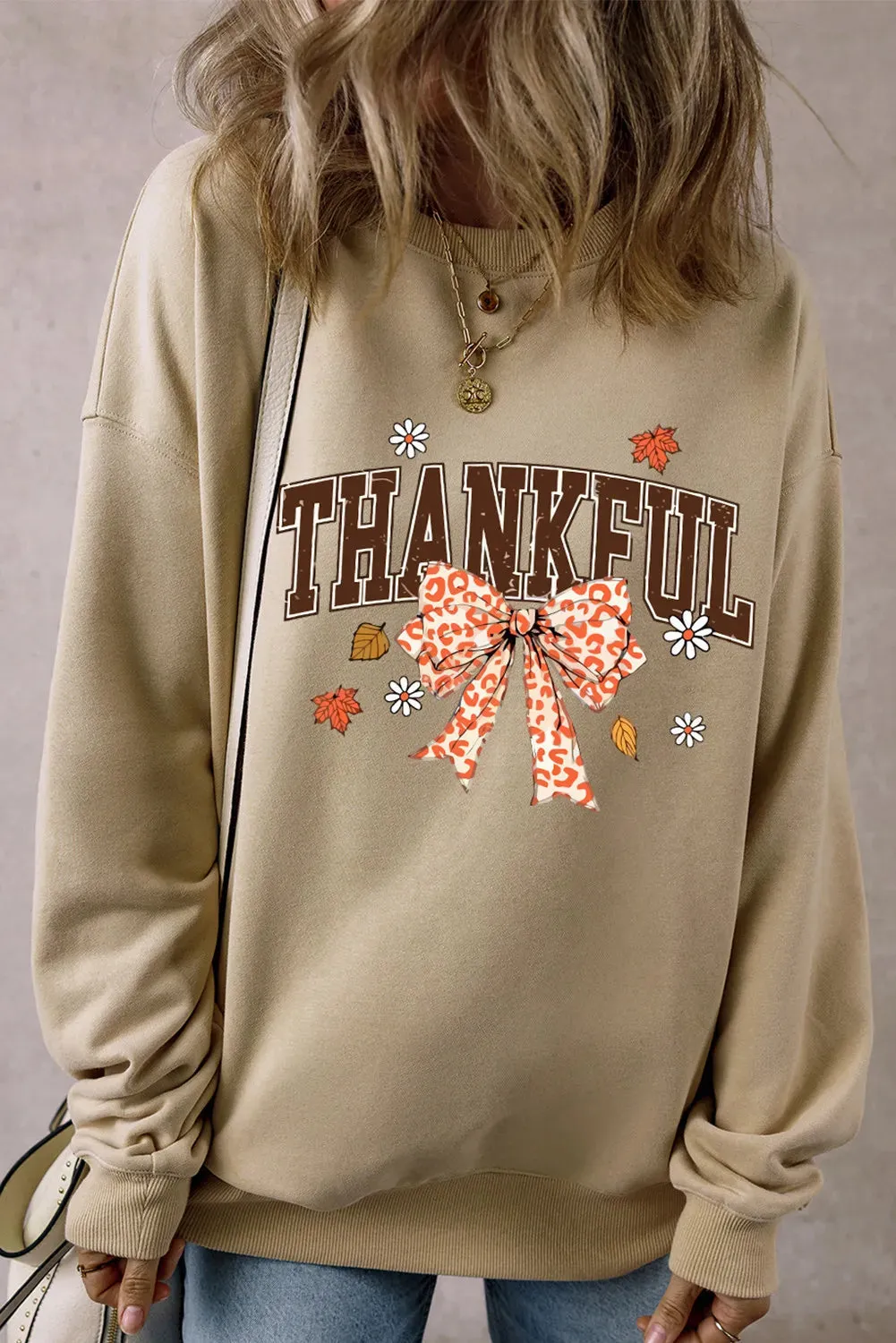 THANKFUL Bow Round Neck Long Sleeve Sweatshirt sold by Charming Charlie