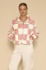 Fuzzy checkered zip front jacket sold by Charming Charlie