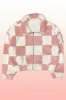 Fuzzy checkered zip front jacket sold by Charming Charlie