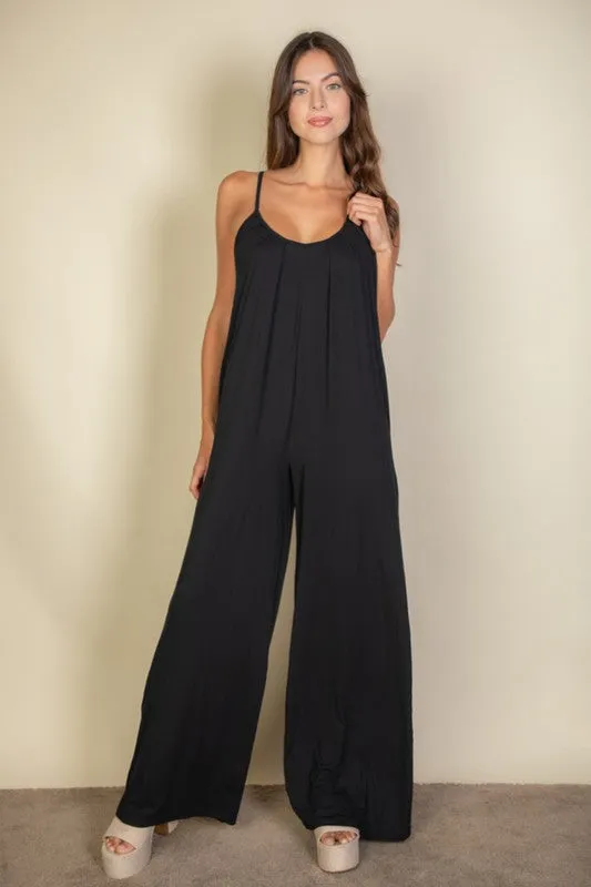 Spaghetti strap solid wide jumpsuit sold by Charming Charlie