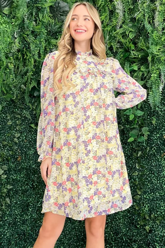 And The Why Floral Mock Neck Flounce Sleeve Dress sold by Charming Charlie