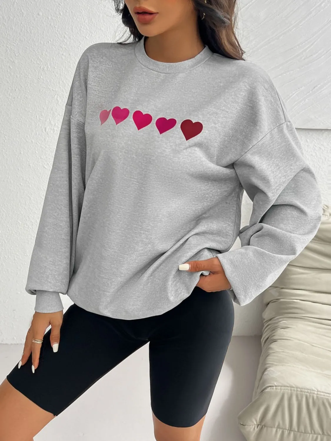 Devine Heart Dropped Shoulder Long Sleeve Sweatshirt sold by Charming Charlie