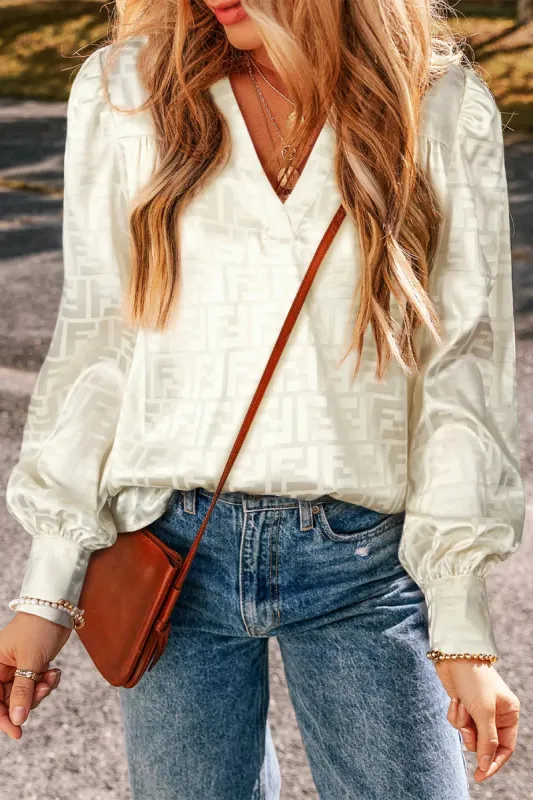 Geometric V-Neck Long Sleeve Blouse sold by Charming Charlie