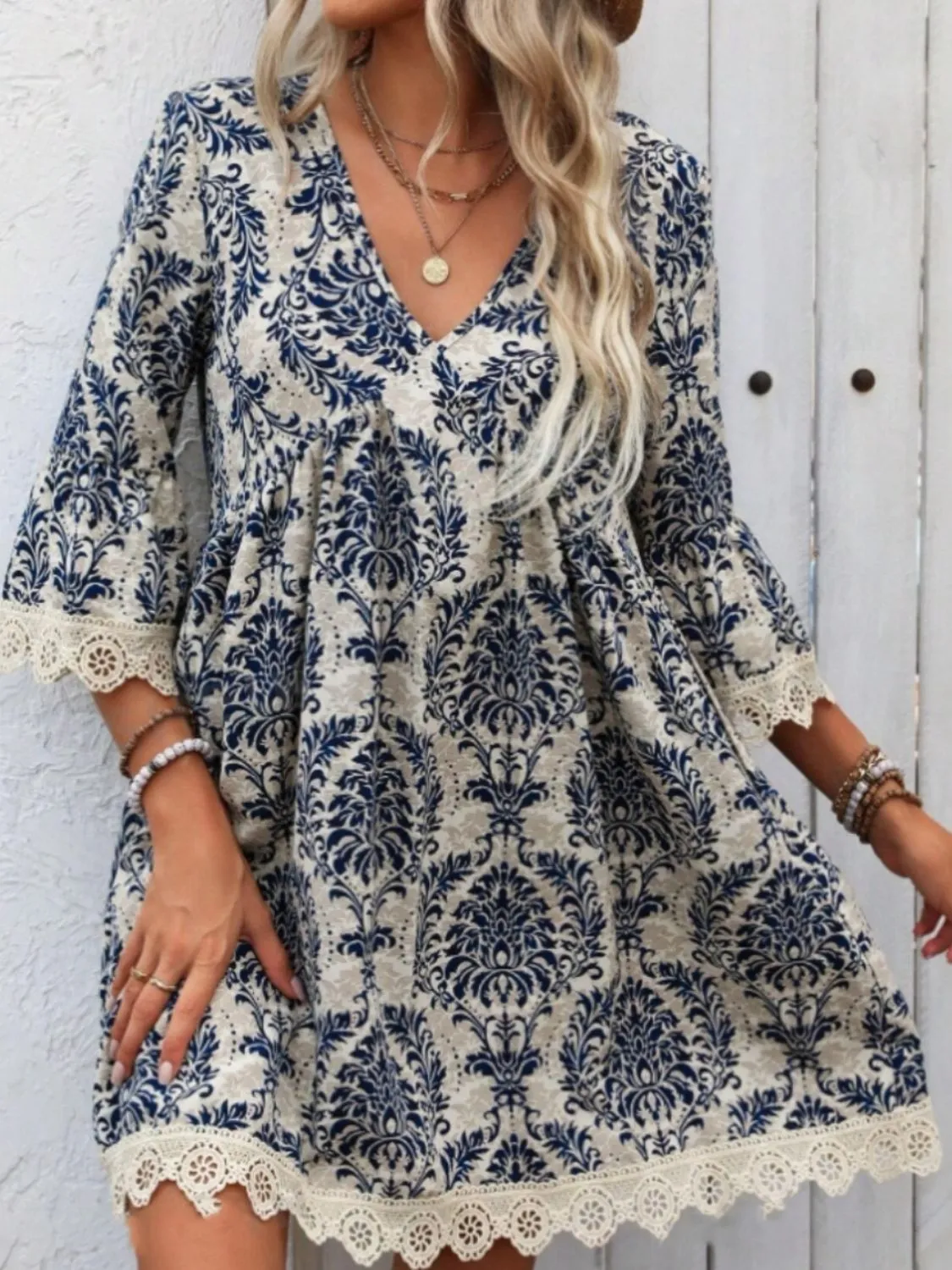 Lace Detail Printed V-Neck Mini Dress sold by Charming Charlie