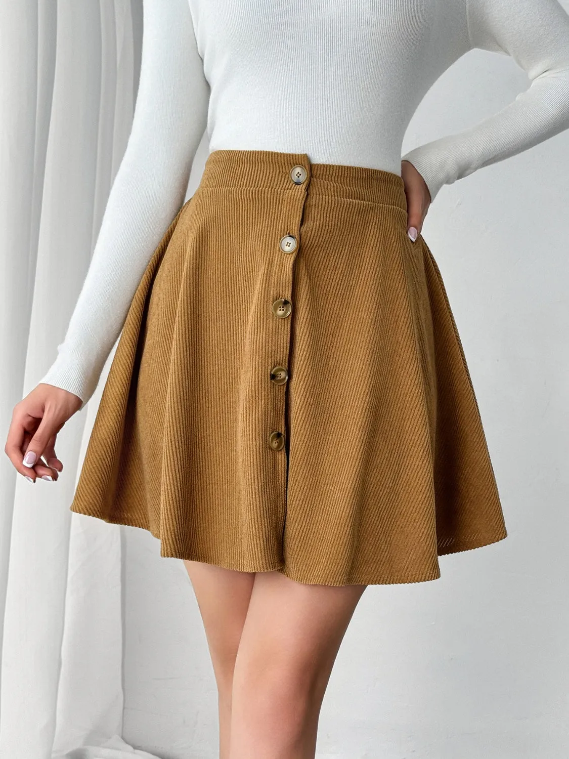 Buttoned Mini Skirt sold by Charming Charlie