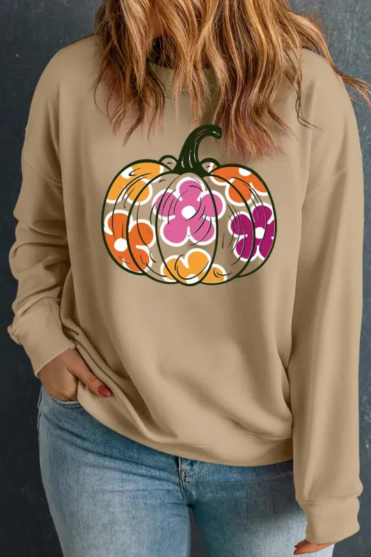 Plus Size Pumpkin Graphic Dropped Shoulder Sweatshirt sold by Charming Charlie