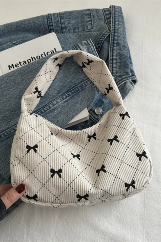 Corduroy Quilted Bow Handbag sold by Charming Charlie