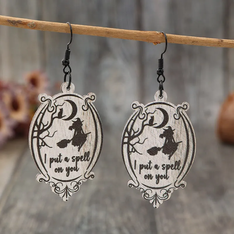 Witch Wooden Dangle Earrings sold by Charming Charlie