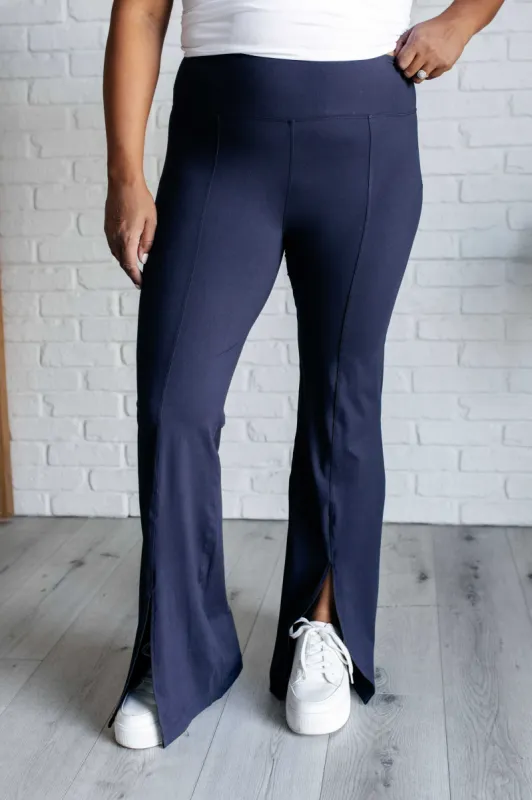 Stamina Stride Flare Leggings in Navy sold by Charming Charlie