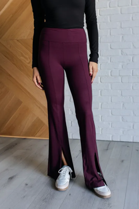Stamina Stride Flare Leggings in Cassis sold by Charming Charlie