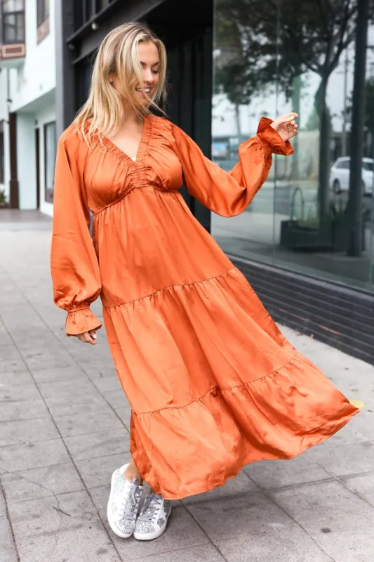 Elegant Rust Elastic V Neck Tiered Satin Maxi Dress sold by Charming Charlie