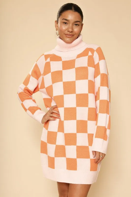 Checkered turtleneck sweater dress sold by Charming Charlie