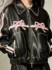 Faux leather bow biker jacket sold by Charming Charlie