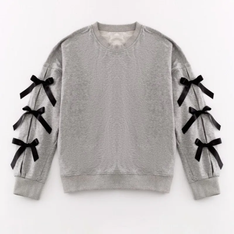 Oversized bow crewneck sweater sold by Charming Charlie