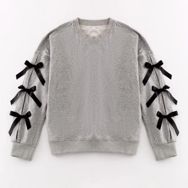 Oversized bow crewneck sweater sold by Charming Charlie