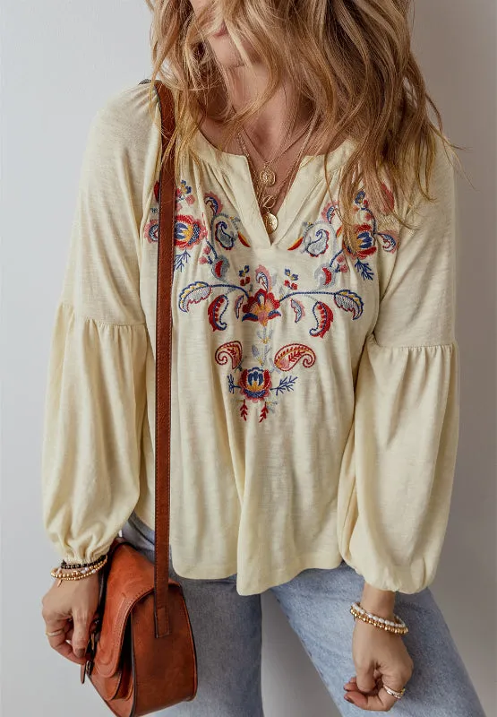 Embroidered Notched Long Sleeve Blouse sold by Charming Charlie