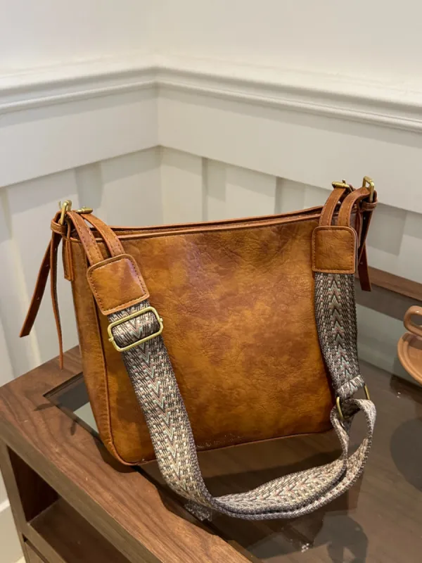 PU Leather Adjustable Strap Crossbody Bag with Pouch sold by Charming Charlie