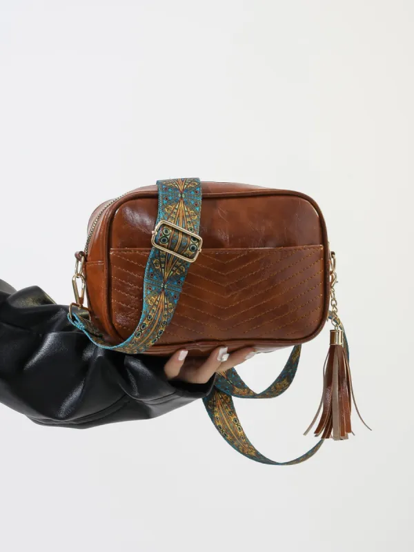 Tassel PU Leather Printed Strap Cassette Crossbody Bag sold by Charming Charlie