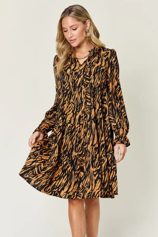 Double Take Full Size Printed Ruffle Hem Long Sleeve Dress sold by Charming Charlie