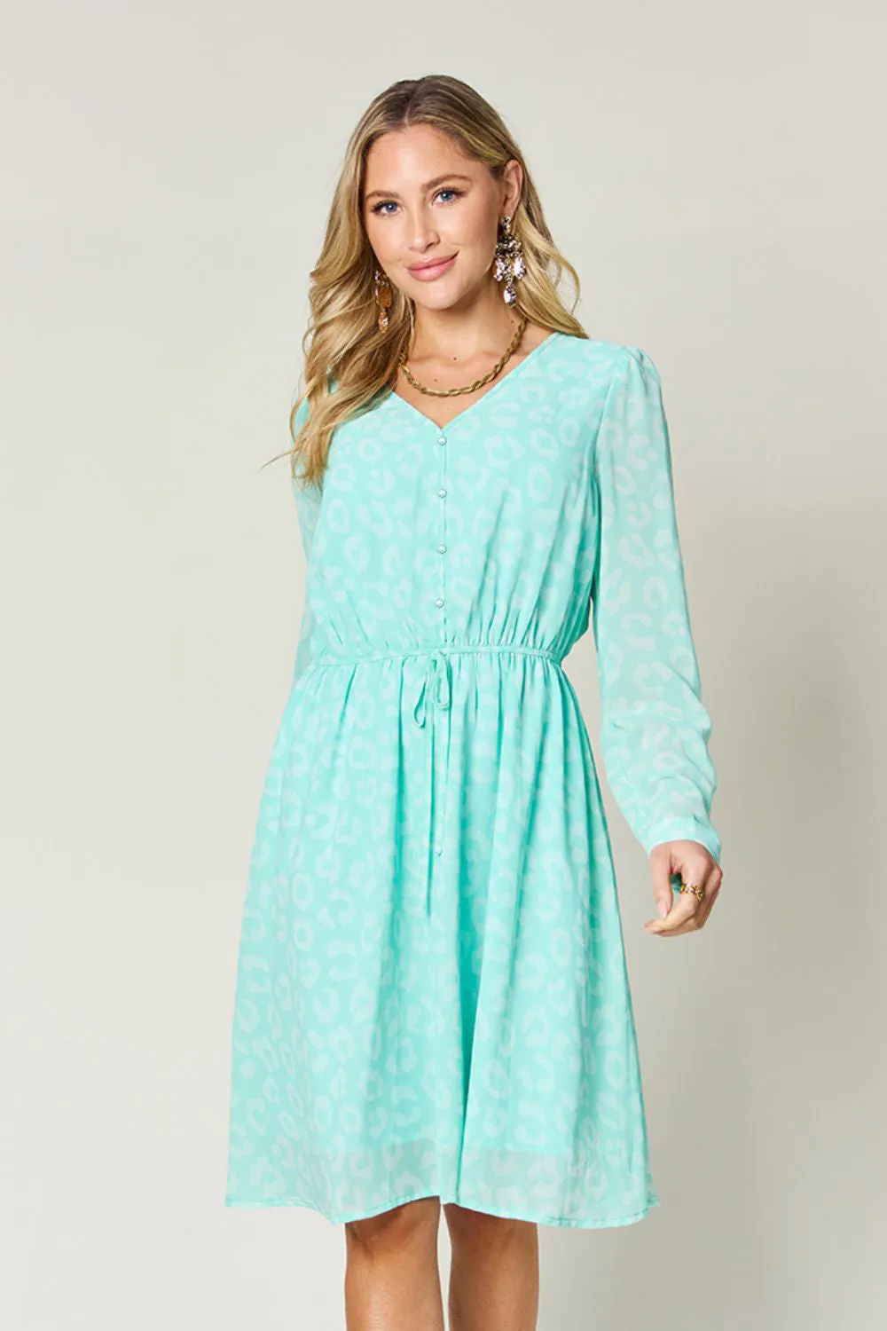 Double Take Full Size Printed Ruched V-Neck Long Sleeve Dress sold by Charming Charlie