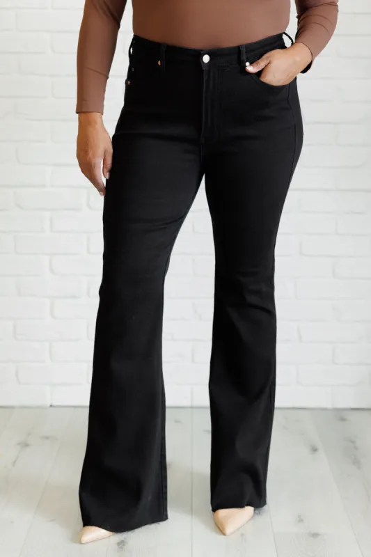 Etta High Rise Control Top Flare Jeans in Black sold by Charming Charlie
