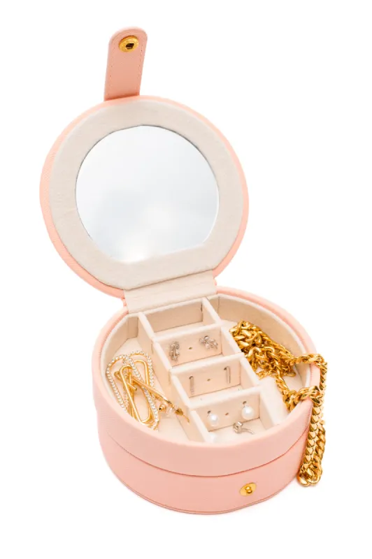 Circular Travel Jewelry Case in Pink sold by Charming Charlie