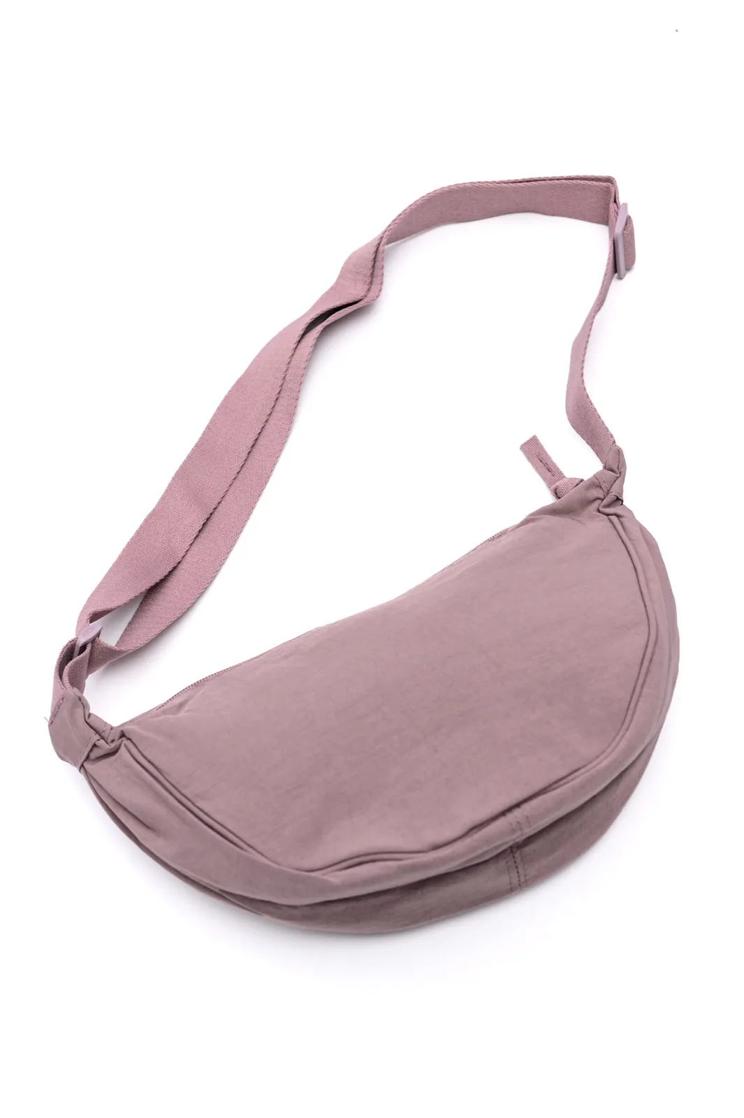 Essentially Everything Round Mini Crossbody Bag in Lavender sold by Charming Charlie