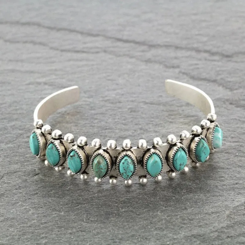 Artificial Turquoise Alloy Open Bracelet sold by Charming Charlie