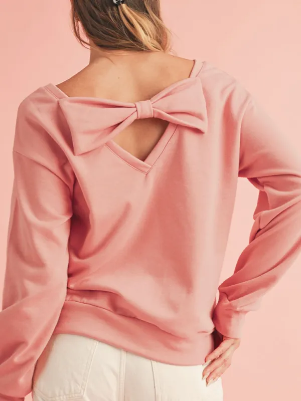 Bow Cutout Round Neck Long Sleeve Sweatshirt sold by Charming Charlie