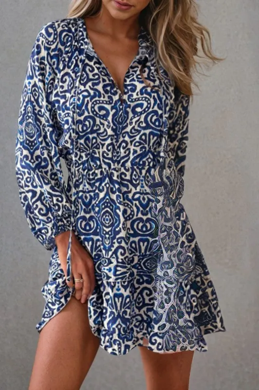 Geometric Ruffled Drawstring V Neck Mini Dress sold by Charming Charlie