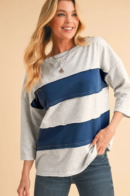Striped Patchwork Raw Edge Sweatshirt sold by Charming Charlie