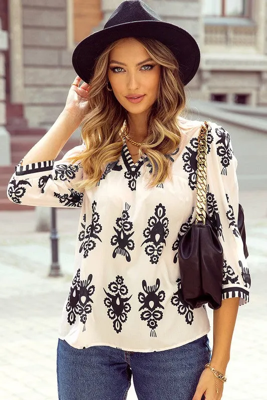 Women Geometric Printed 3/4 Sleeve V Neck Blouse sold by Charming Charlie