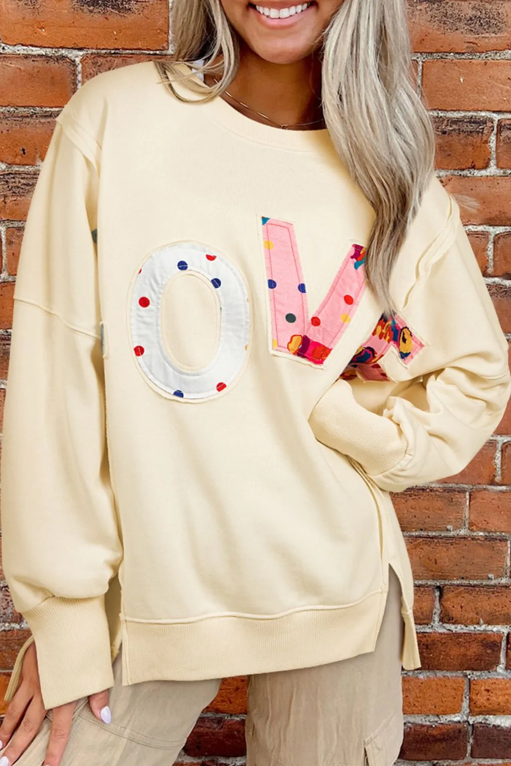 LOVE Patch Round Neck Sweater sold by Charming Charlie
