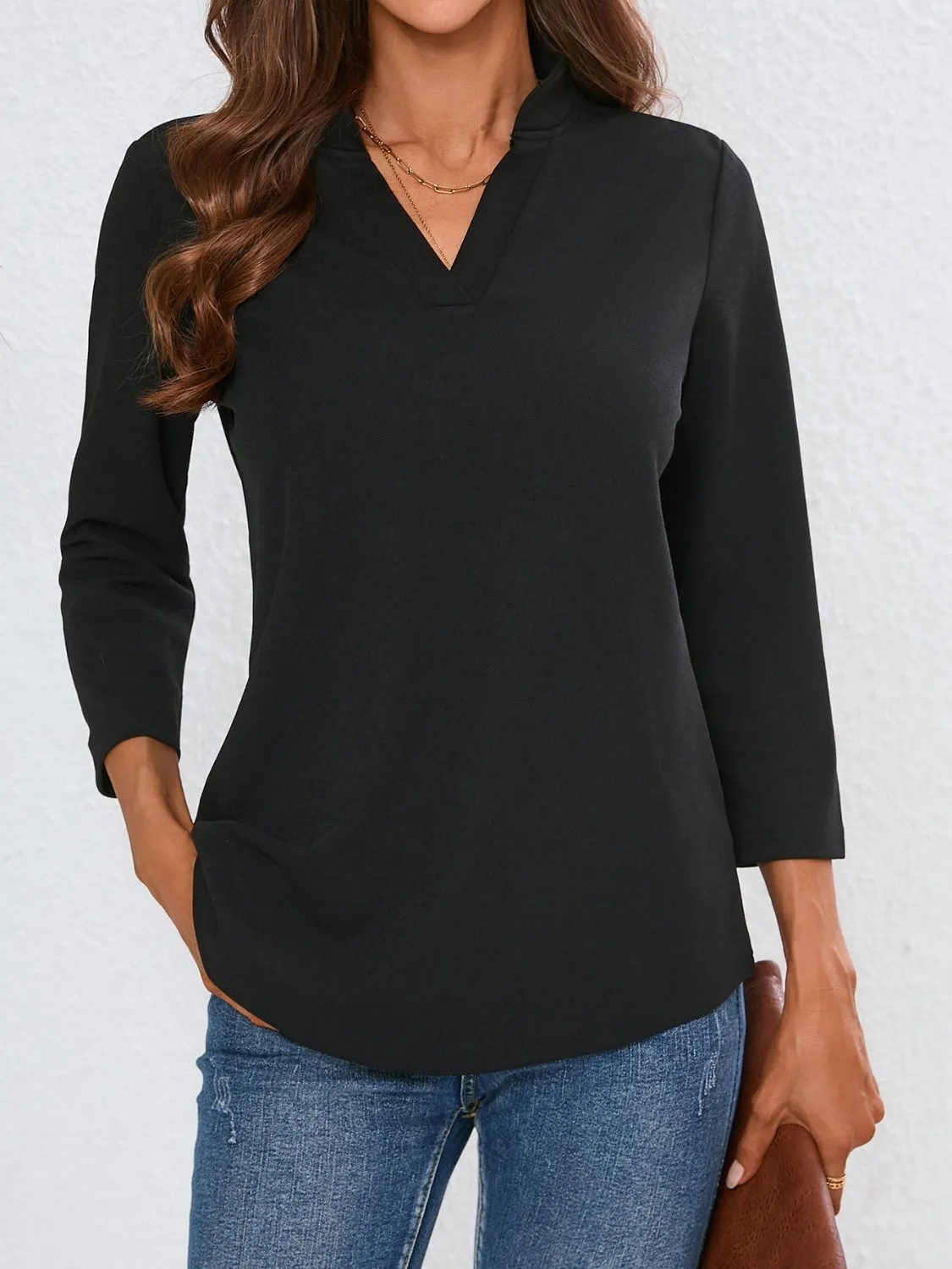 Notched Three-Quarter Sleeve Top sold by Charming Charlie