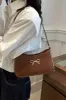 Bow Trim PU Leather Shoulder Bag sold by Charming Charlie