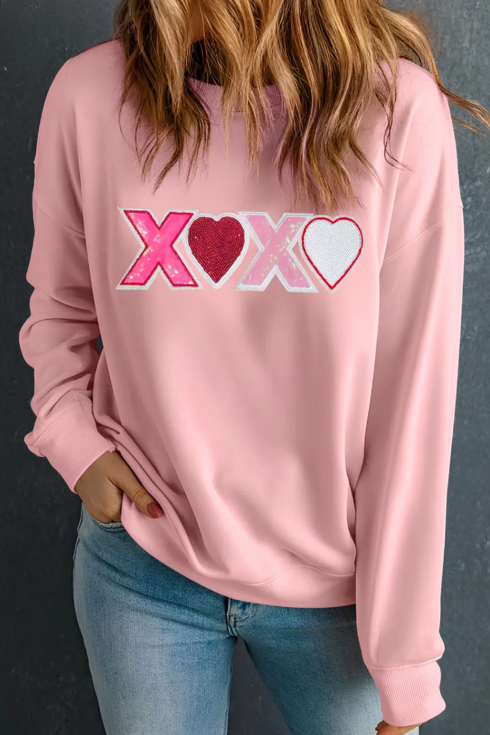 Valentine’s Day XOXO Round Neck Long Sleeve Sweatshirt sold by Charming Charlie