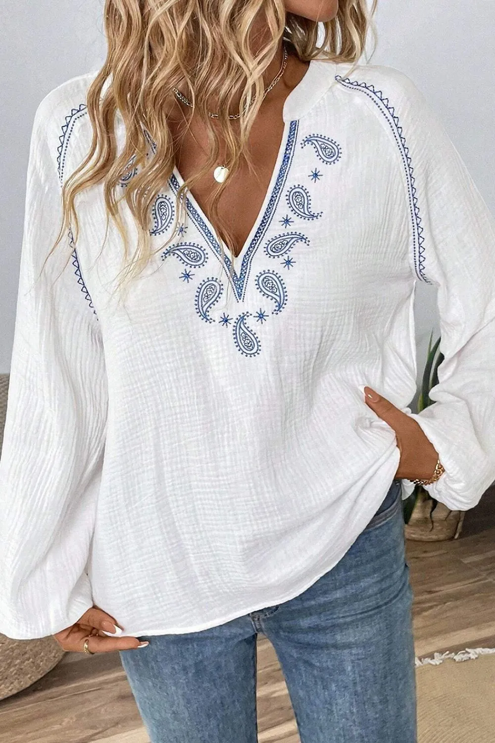 Embroidered Notched Long Sleeve Blouse sold by Charming Charlie