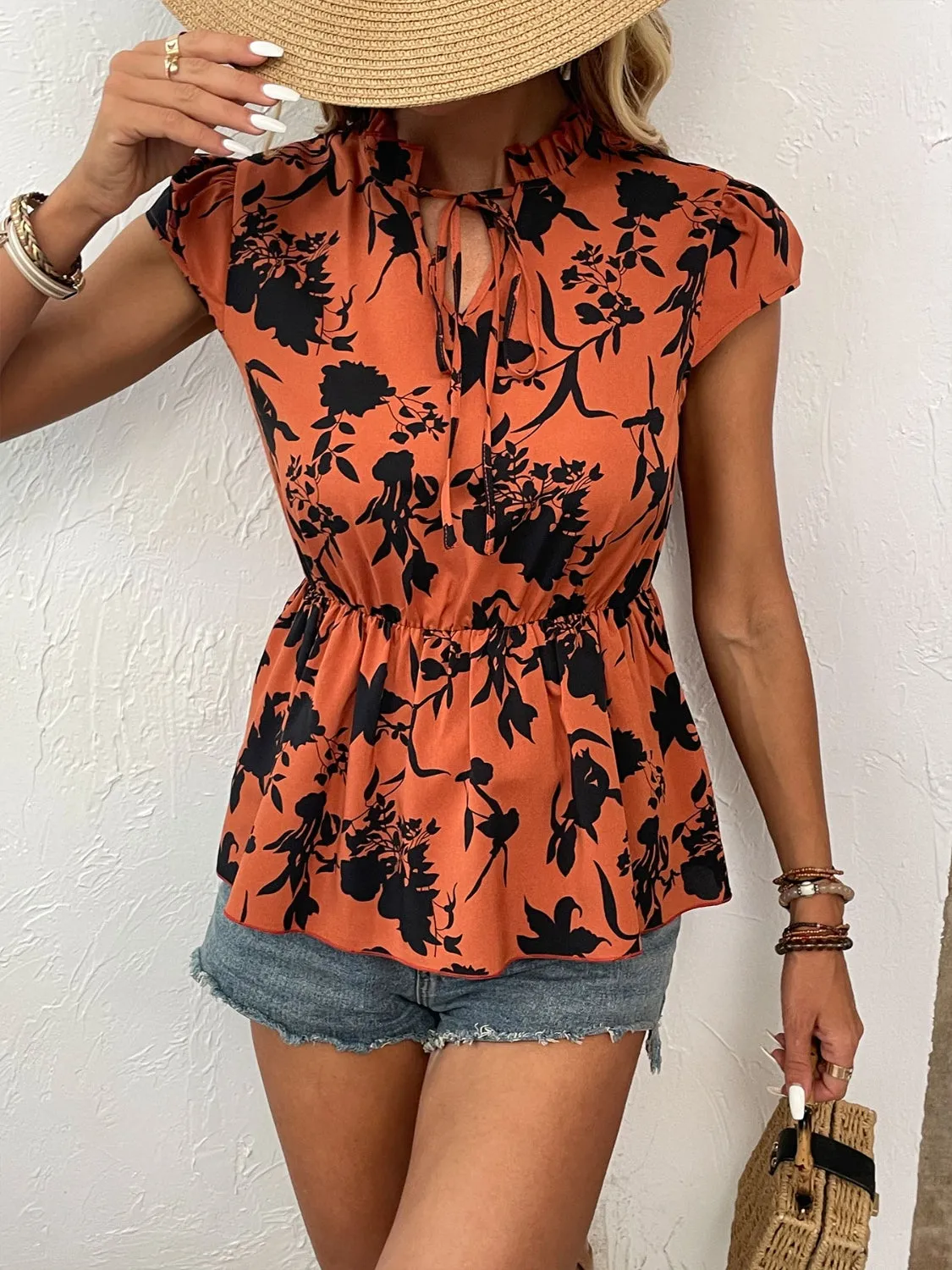 Printed Tie Neck Cap Sleeve Blouse sold by Charming Charlie