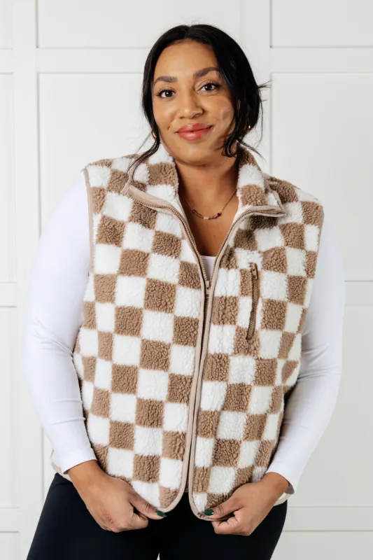 Check it Out Checkered Fleece Vest sold by Charming Charlie