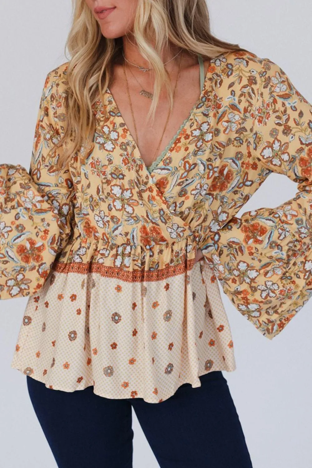 Peplum Printed Surplice Flare Sleeve Blouse sold by Charming Charlie product image thumbnail 5
