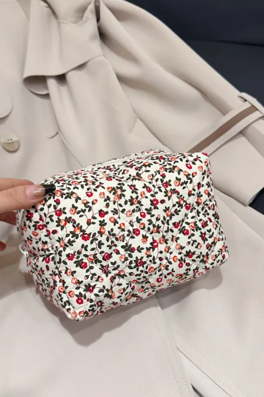 Floral Quilted Clutch with Plaid Lining sold by Charming Charlie