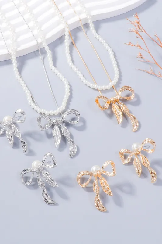 Synthetic Pearl Necklace, Bow Necklace and Bow Earrings Jewelry Set sold by Charming Charlie